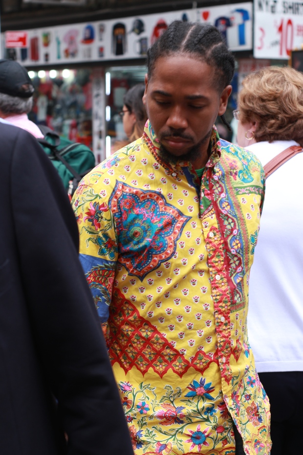 portrait of man in colourful t-shirt in new york